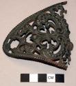 Bronze hand guard, floral openwork motif, broken, remnants of solder