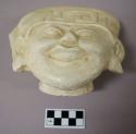 Cast of "laughing face"- geometric design in bas relief on forehead