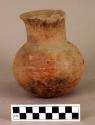 Pottery jar with 3 red spots around center