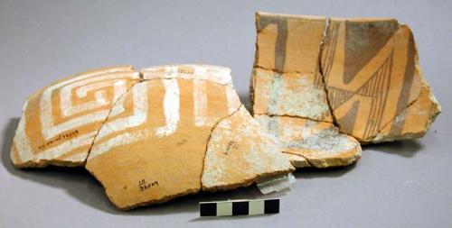 Partially reconstructed vessel and glued sherds