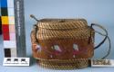 Grass basket with center band of bark; porcupine quill decoration.