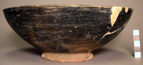 Restored polished dark pottery ring based bowl