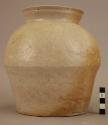 Mottled tan and white ware urn - traces of glaze