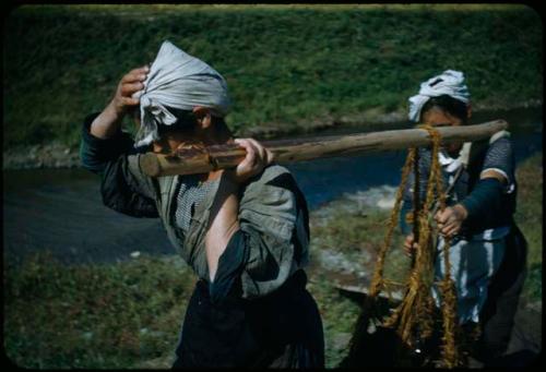 Women hauling rock