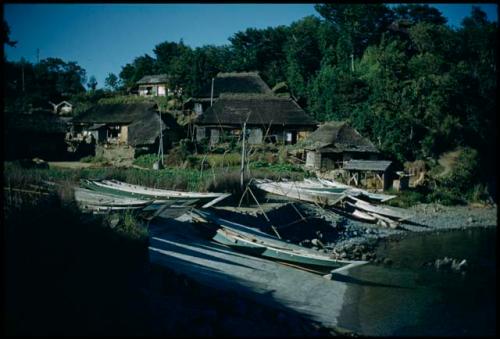 Boats docked, with buildings in background