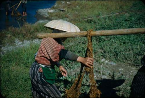 Woman hauling rock