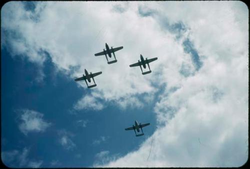 Four airplanes flying in formation