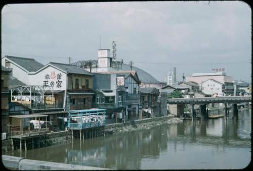 Bridge, and buildings along shore