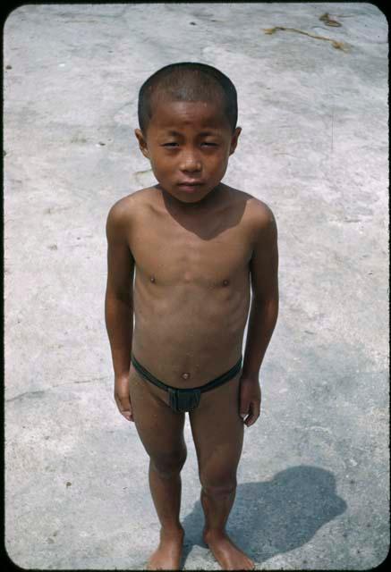 Boy standing on beach