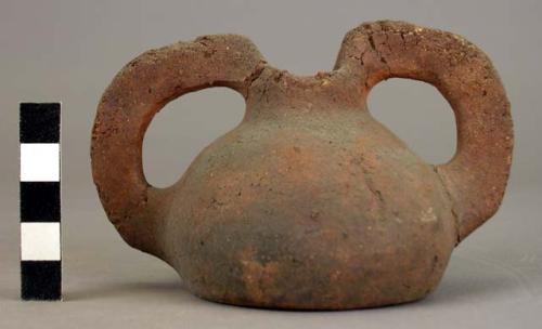 Small round pottery jar with two handles