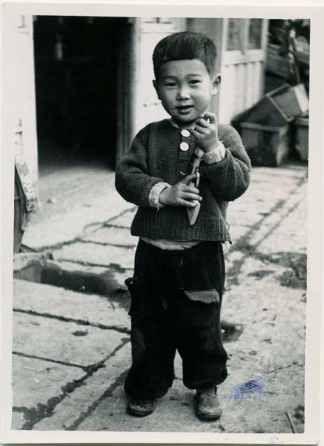 Boy with toy gun