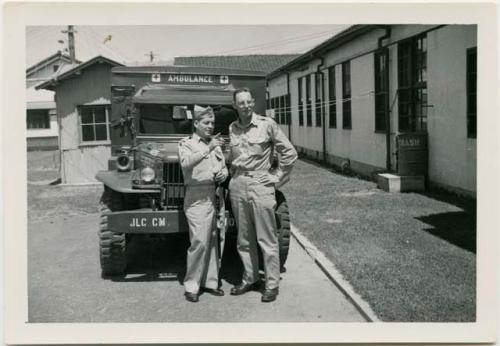 George Butler and another soldier in front of ambulance