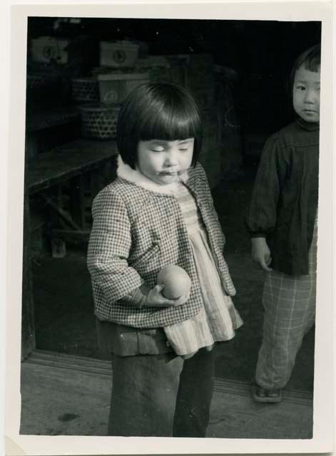 Girl holding a pear