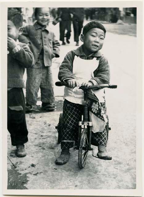 Boy on tricycle