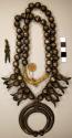 Silver "squash blossom" necklace. Mostly round beads w/ eight squash blossoms