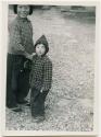 Woman and boy dressed in winter clothing