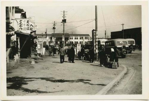 Street corner, with railroad station in background