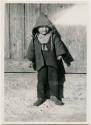 Boy dressed in winter clothing