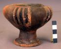 Fluted black pottery bowl, ring base