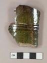 Dark green lead glazed redware vessel body fragment