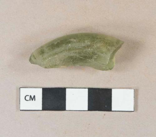 Light green vessel glass base fragment, likely bottle glass