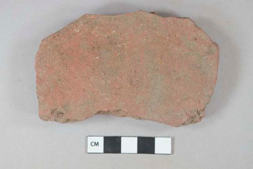 Red ceramic roof tile fragment, visible temper