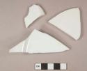 White undecorated porcelain vessel body and base fragments, white paste