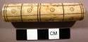 Needle case with incised linear and circular markings