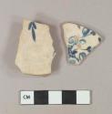 Blue on white handpainted porcelain vessel body and base fragments, white paste, likely English soft paste porcelain