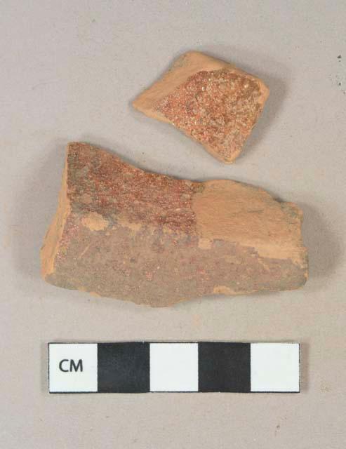 Reddish brown lead glazed redware fragment, possible vessel body