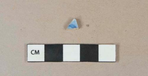 Blue on white transfer decorated eathenware vessel body fragment, white paste