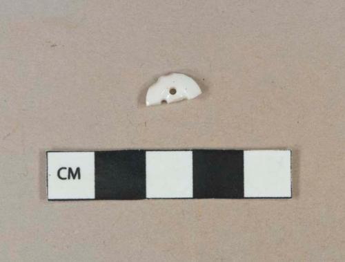 White undecorated porcelain 4-hole button fragment, white paste