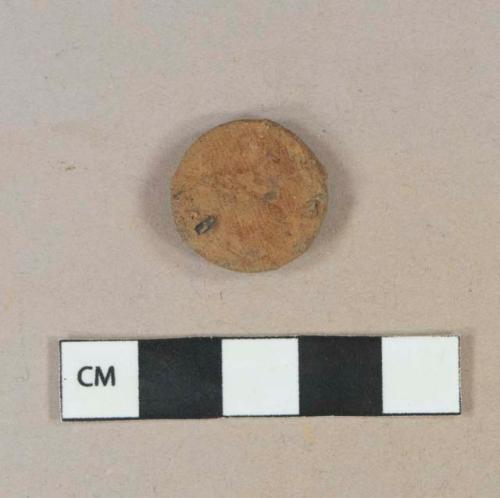 Button, ferrous, fragment; textile impressed, heavily corroded