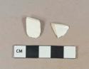 Undecorated whiteware vessel rim fragments, white paste