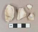 White kaolin pipe bowl fragments, "E" stamped on foot base