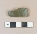 Olive green glass vessel body fragment, degraded