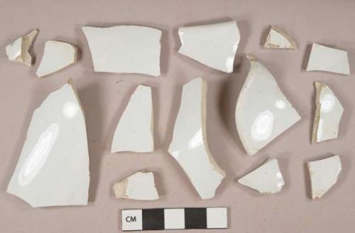 White undecorated ironstone vessel body and rim fragments, white paste