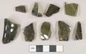 Olive green vessel body and base fragments, likely bottle glass