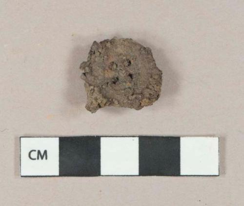 Ferrous metal four hole button, heavily corroded