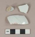 White undecorated ironstone vessel body fragments, white paste