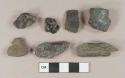 Burned coal fragments, 1 dark olive green glass fragment