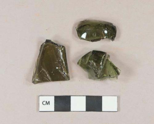 Olive green vessel glass fragments, likely bottle glass