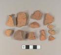 Brick fragments; one redware roof tile fragment; one stone fragment