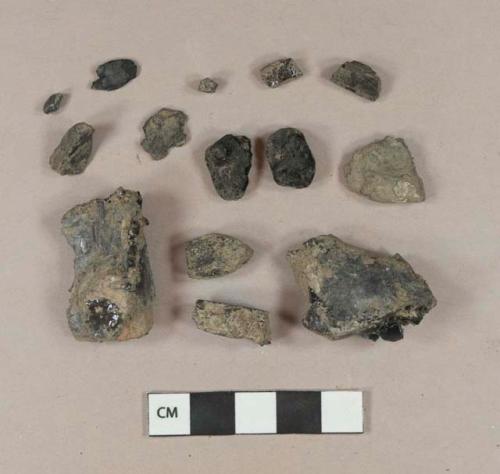 Eight coal fragments; six charcoal fragments; one slag fragment