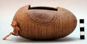 Gourd with incised decoration and rectangular opening on long side; 3 +