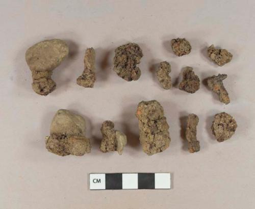 Unidentified iron fragments; unidentified iron nail fragments; unidentified iron fragments adhered to rocks