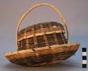 Basket with cover and handle, attached to tray - alternate bands of tan and blac