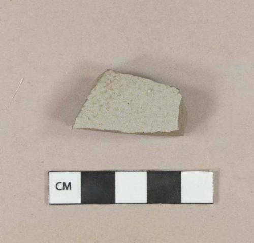 Undecorated gray salt glazed stoneware body sherd with albany glazed interior