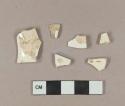 Five undecorated creamware body sherds; one undecorated whiteware body sherd