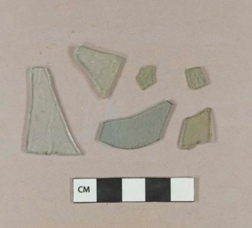 Five aqua flat glass fragments; one aqua bottle glass fragment